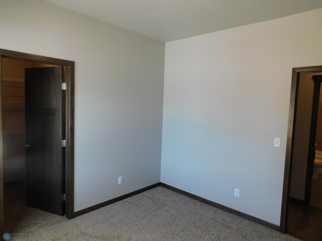 spare room with light colored carpet