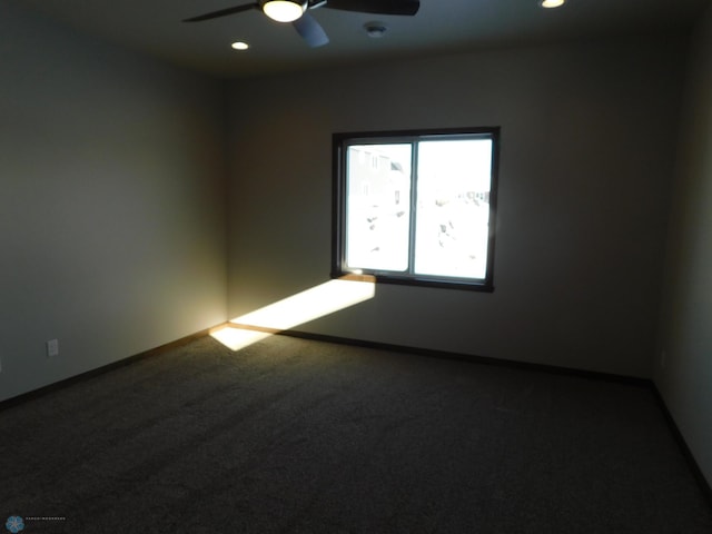 empty room with ceiling fan and carpet