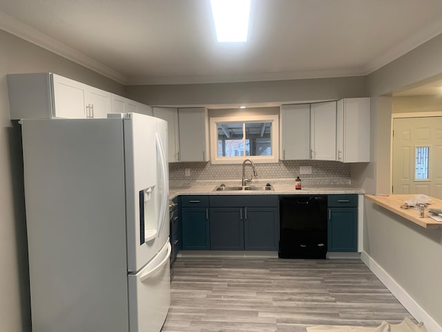 kitchen with tasteful backsplash, black dishwasher, sink, white fridge with ice dispenser, and crown molding