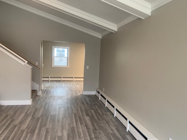 interior space with dark hardwood / wood-style flooring, a baseboard heating unit, ornamental molding, and vaulted ceiling with beams