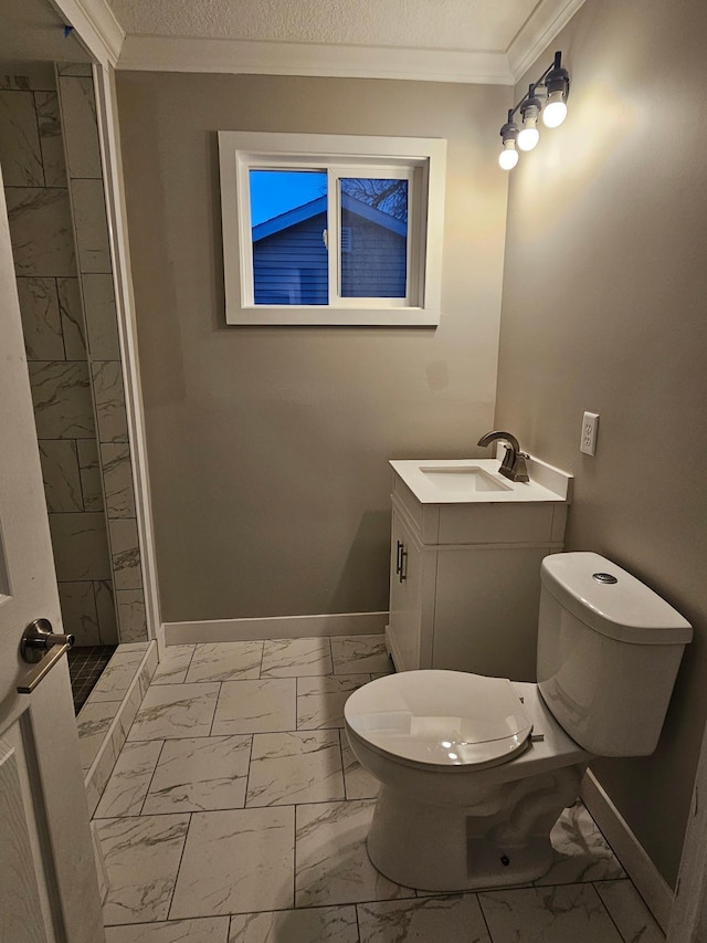 bathroom with vanity, ornamental molding, a textured ceiling, toilet, and walk in shower