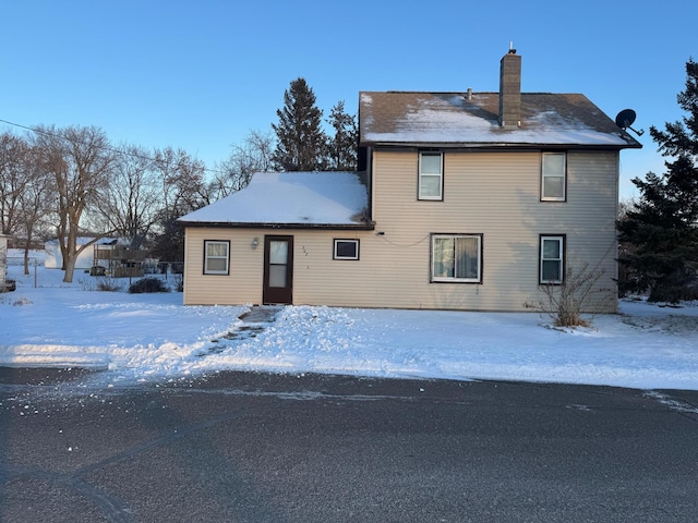 view of snow covered house