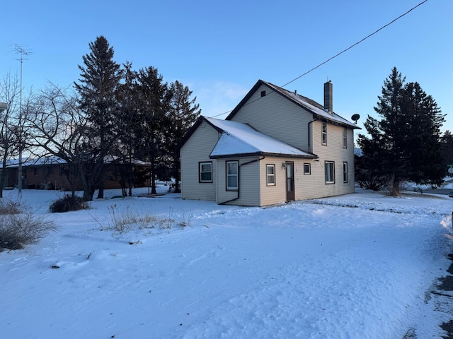 view of snow covered house