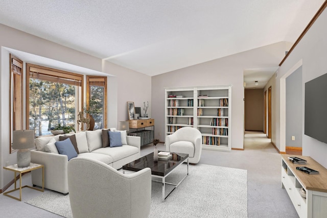 living room featuring light carpet, vaulted ceiling, and a textured ceiling