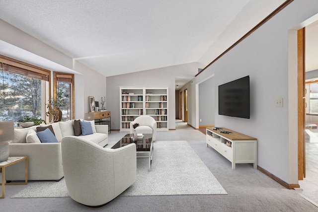 carpeted living room with lofted ceiling and a textured ceiling