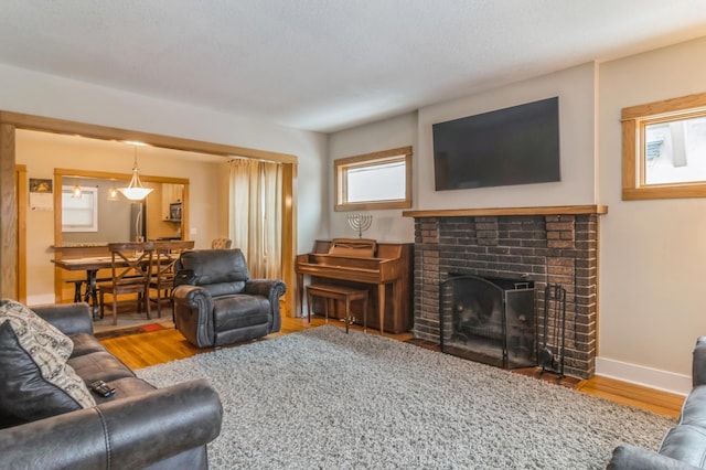 living room featuring hardwood / wood-style floors and a fireplace