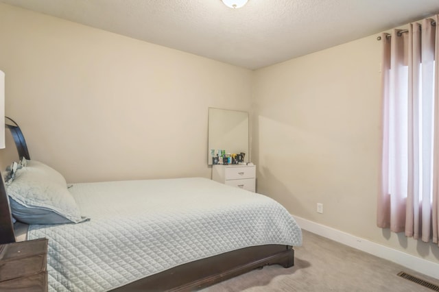 bedroom with light colored carpet