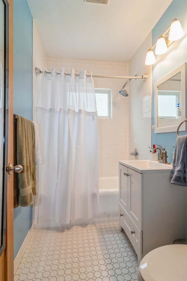 bathroom with vanity, tile patterned floors, and toilet