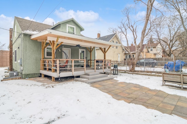 view of front of house with cooling unit, a porch, and ceiling fan