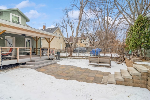 view of snow covered patio