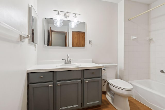 full bathroom with vanity, toilet, shower / bath combination, and wood-type flooring