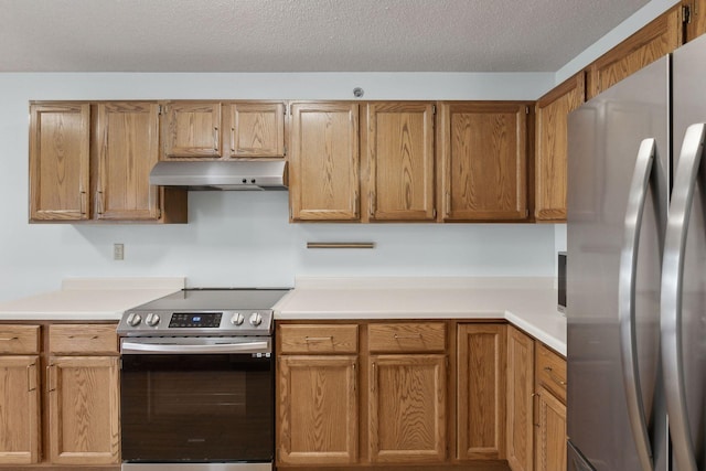 kitchen featuring light countertops, extractor fan, brown cabinets, and stainless steel appliances