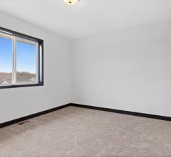 view of carpeted spare room