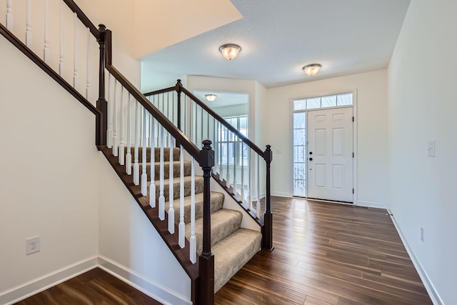 entryway featuring dark wood-type flooring