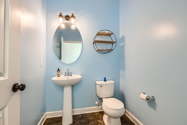 bathroom featuring sink and toilet