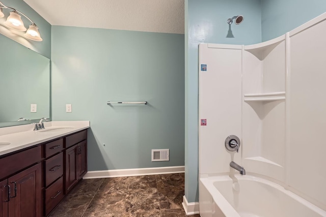 bathroom featuring vanity and a textured ceiling