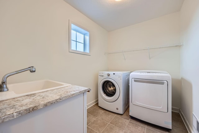 laundry room featuring washer and dryer and sink