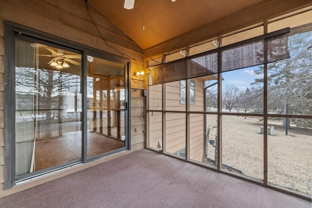 unfurnished sunroom with vaulted ceiling and ceiling fan