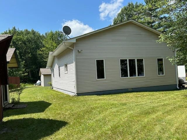 view of side of home featuring a yard