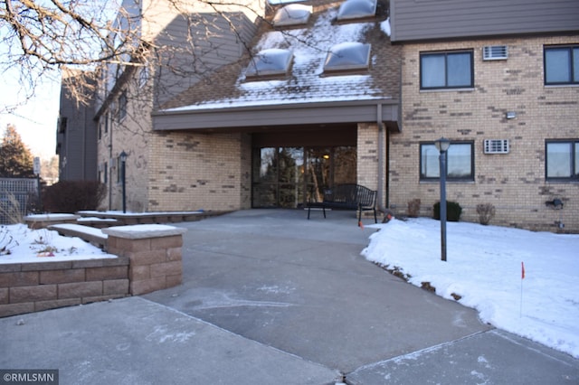 view of snow covered property entrance