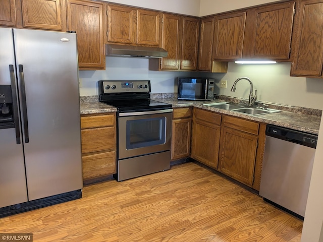 kitchen featuring light hardwood / wood-style floors, sink, and appliances with stainless steel finishes