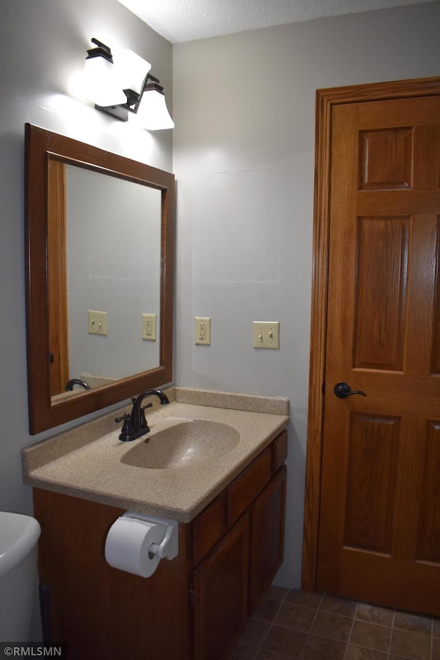 bathroom featuring vanity and tile patterned flooring