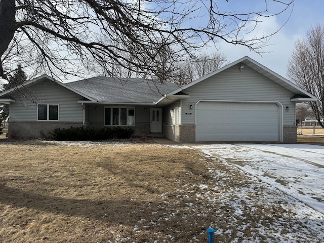 single story home with a garage and a yard