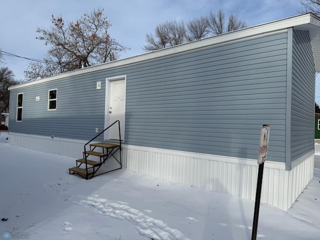 view of snow covered house