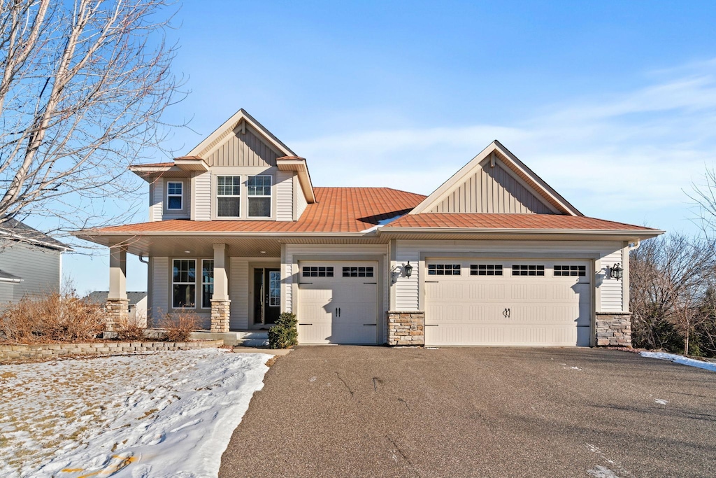 view of front of property featuring a garage and a porch