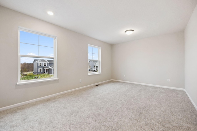 empty room featuring carpet floors