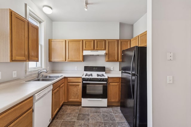 kitchen featuring sink and white appliances