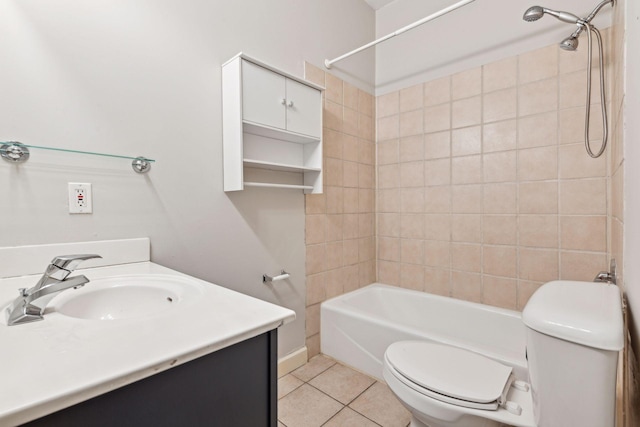 full bathroom with toilet, tile patterned flooring, tiled shower / bath, and vanity