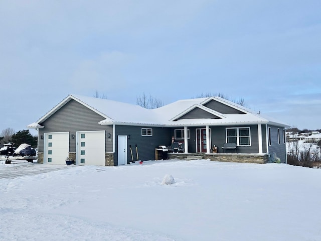 view of front of home featuring a garage and a porch