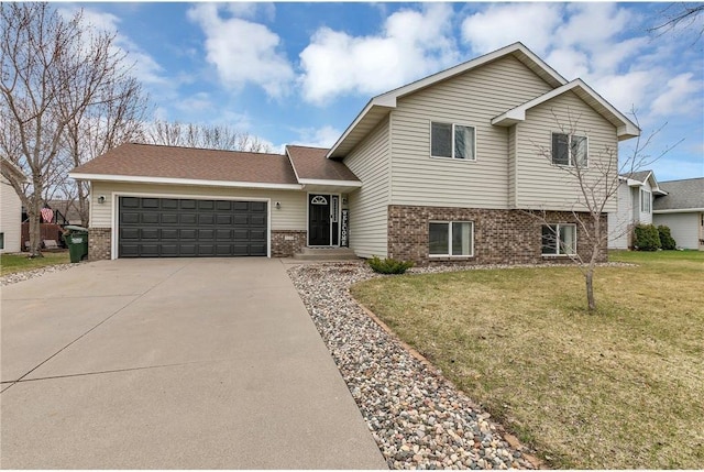 tri-level home featuring a front yard and a garage