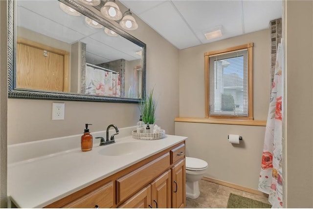 bathroom with toilet and vanity