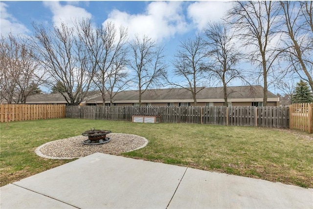 view of yard featuring a fire pit and a patio