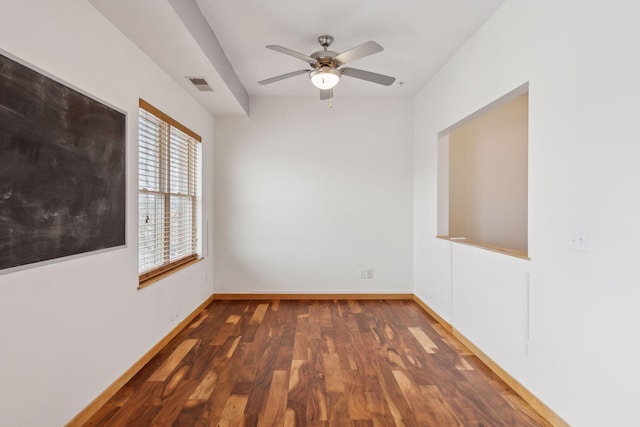 unfurnished room with ceiling fan and dark hardwood / wood-style flooring