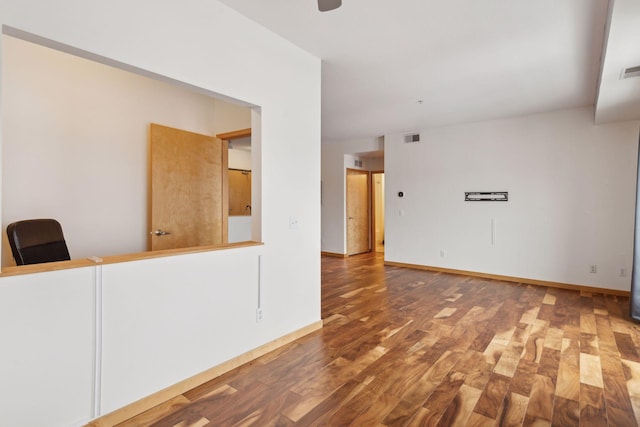 unfurnished room with hardwood / wood-style flooring