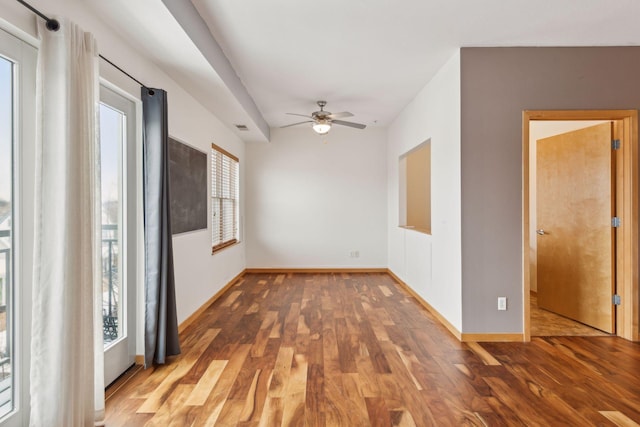 empty room featuring ceiling fan and wood-type flooring