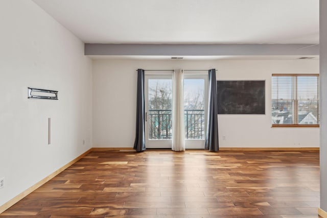 unfurnished room featuring dark hardwood / wood-style floors