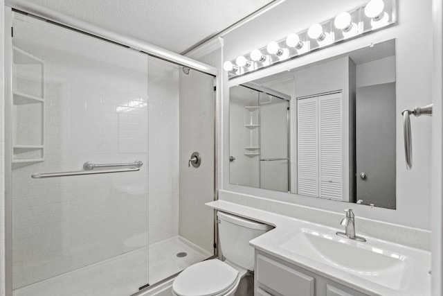 full bath with toilet, a stall shower, a textured ceiling, and vanity