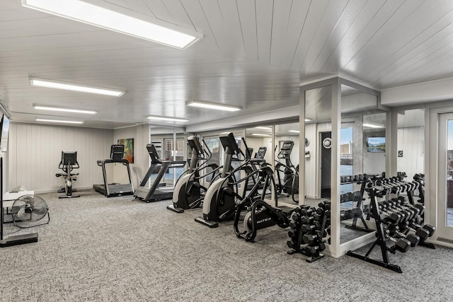 gym featuring wood ceiling and carpet flooring