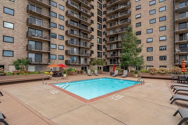 view of swimming pool with a patio area