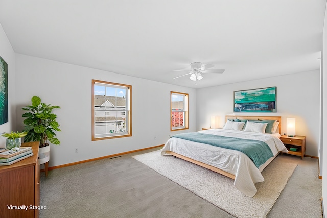 bedroom with light carpet and ceiling fan