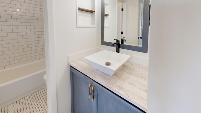 full bathroom featuring vanity, tiled shower / bath combo, tile patterned floors, and toilet