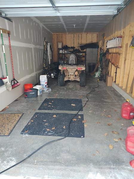 garage featuring wooden walls