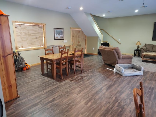 dining area with vaulted ceiling and dark hardwood / wood-style flooring