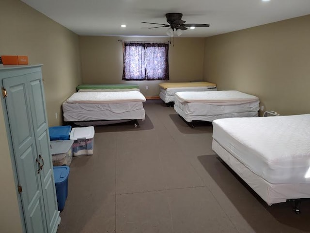 bedroom with ceiling fan and tile patterned flooring