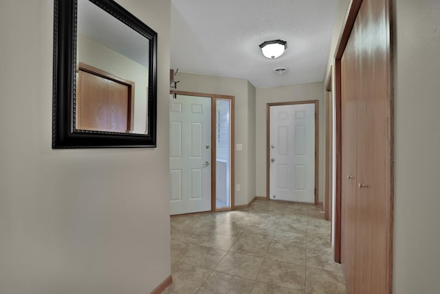 interior space featuring a textured ceiling