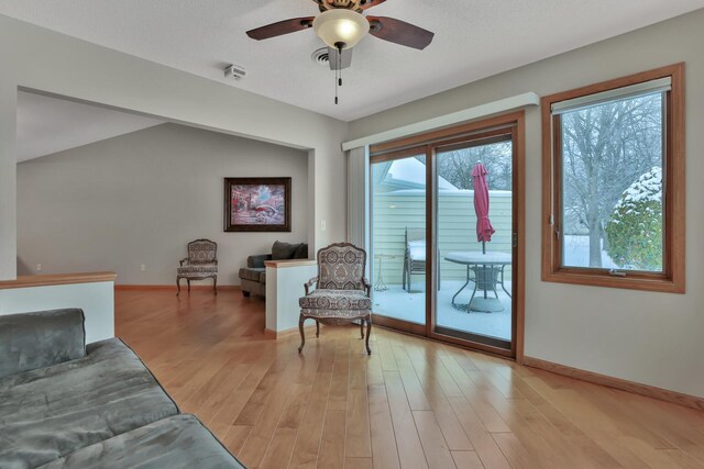 sitting room featuring ceiling fan and light hardwood / wood-style floors